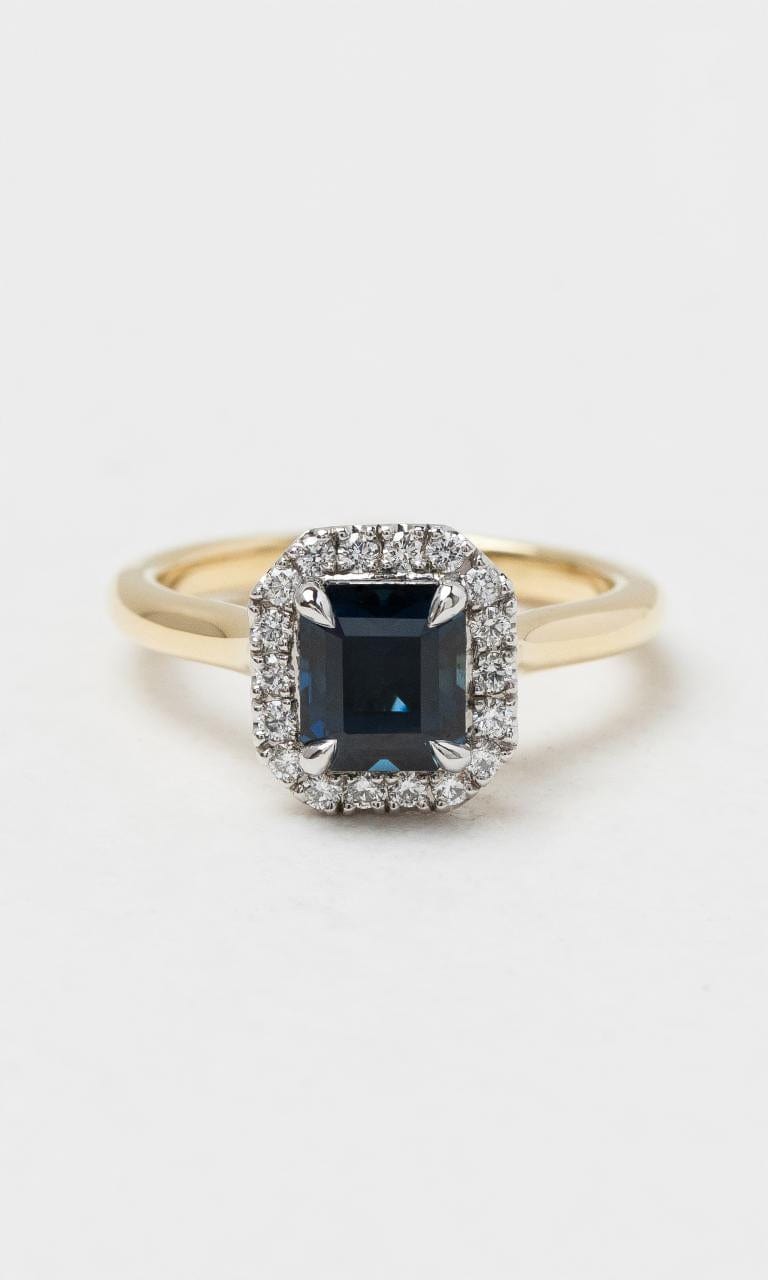 2024 © Hogans Family Jewellers 18K YWG Emerald Cut Australian Sapphire & Diamond Halo Ring