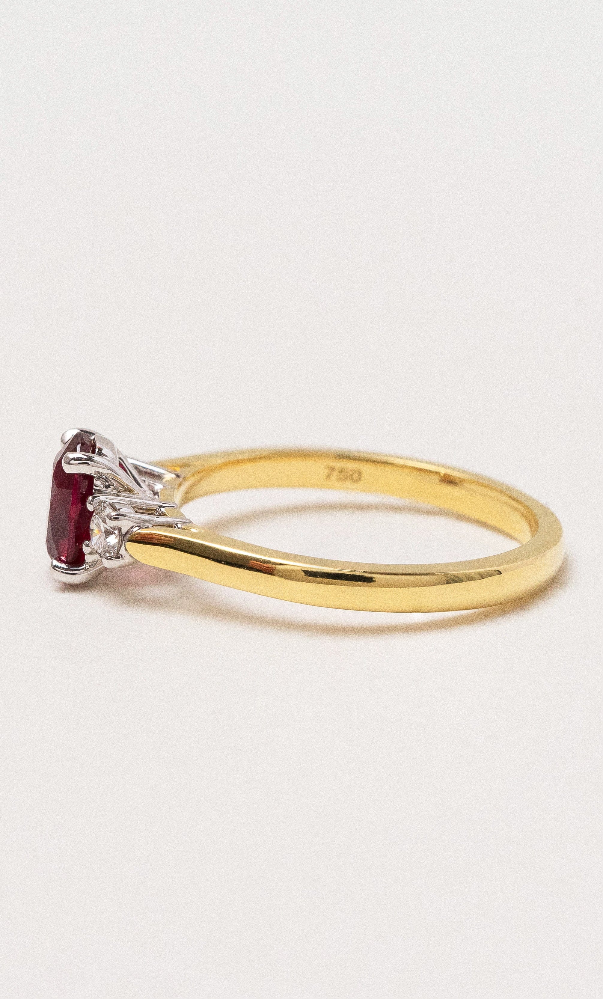 2024 © Hogans Family Jewellers 18K YWG Oval Cut Ruby Trilogy Ring