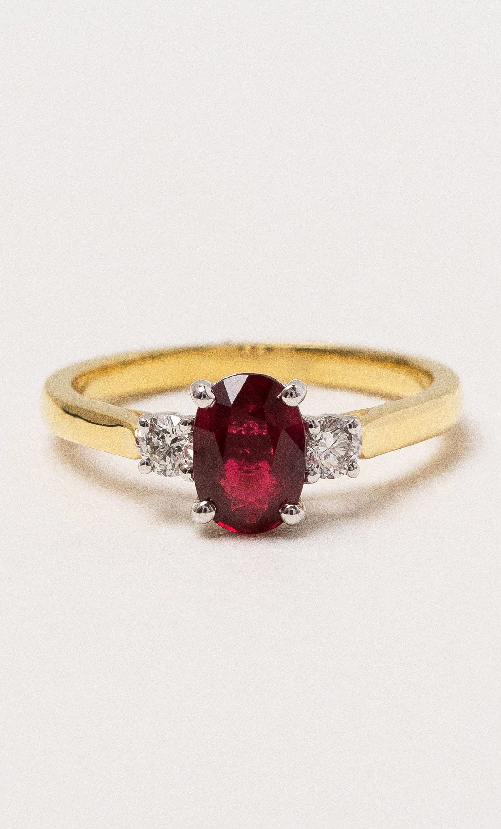 2024 © Hogans Family Jewellers 18K YWG Oval Cut Ruby Trilogy Ring