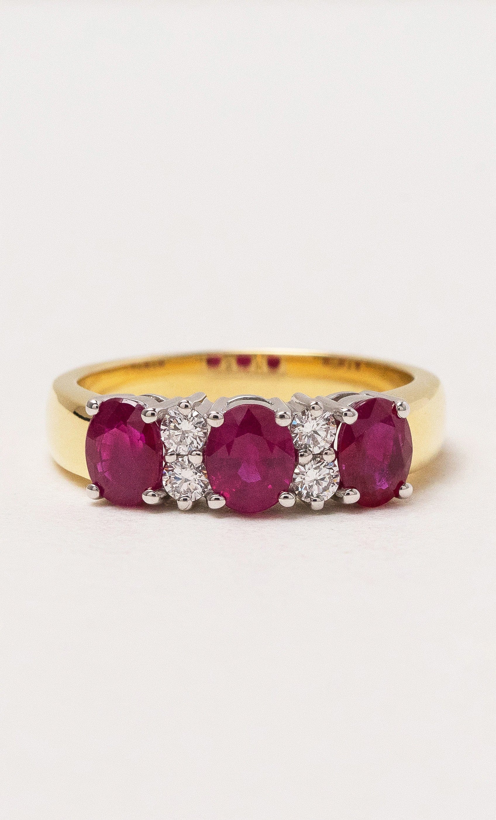 2024 © Hogans Family Jewellers 18K YWG Oval Ruby & Diamond Band